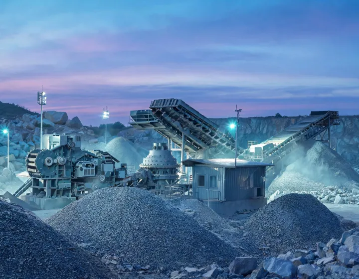 Hybrid-electric jaw crusher feeding a cone and vibrating screen circuit at limestone quarry